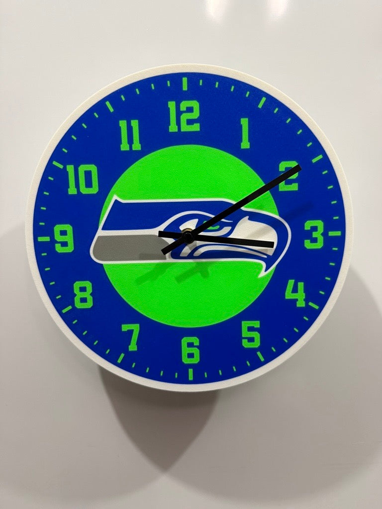 Wall clock with a sports team logo on a blue and green background