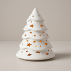 White Christmas tree with glowing star cutouts on a studio background