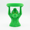 Green Grumpy Guy candle holder front view on a white background