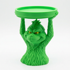 Green Grumpy Guy candle holder angled view on a white background